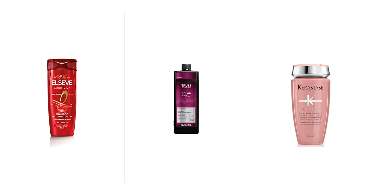 Seis frascos de shampoo para cabelo colorido alinhados sobre bancada de mármore branco